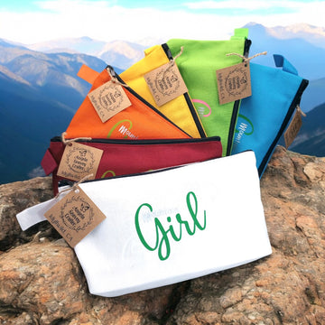 Mountain Girl Bundle Zipper bags in assorted colors White, Red, Orange, Yellow, Green or Blue with mountain skyline in the background